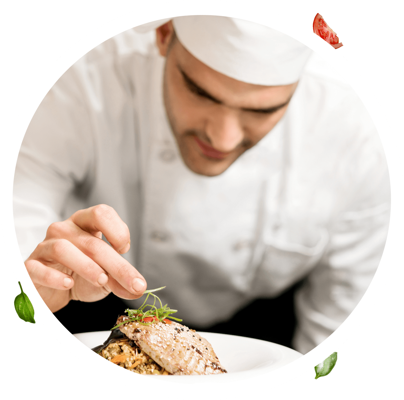 Group 1321317615 Chef garnishing a dish with herbs in a professional kitchen.